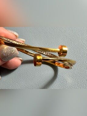 Gold-Tone Twisted Nail Bangle with Crystal Row